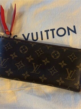 Authentic Louis Vuitton Adele Monogram Canvas Wallet with Red Leather Zip Pull